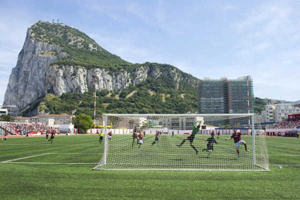 Lincoln Red Imps FC and College Europa FC's players take part in the Gibraltar Cup final football match Lincoln Red Imps FC vs College Europa FC at the Victoria Stadium in Gibraltar on May 10, 2014. UEFA President Michel Platini visited Gibraltar today and attended the Rock Cup final. AFP PHOTO / MARCOS MORENO (Photo credit should read MARCOS MORENO/AFP/Getty Images)